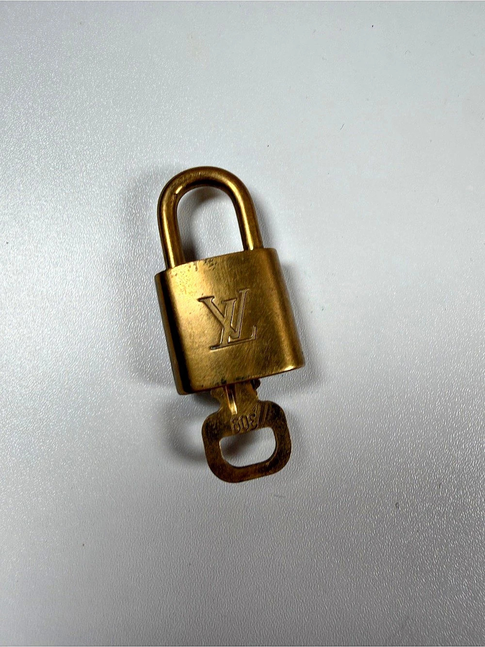 Louis Vuitton Lock and Key 309 Gold